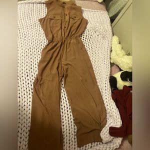 It is a jump suit it is brown , and it is a size large .